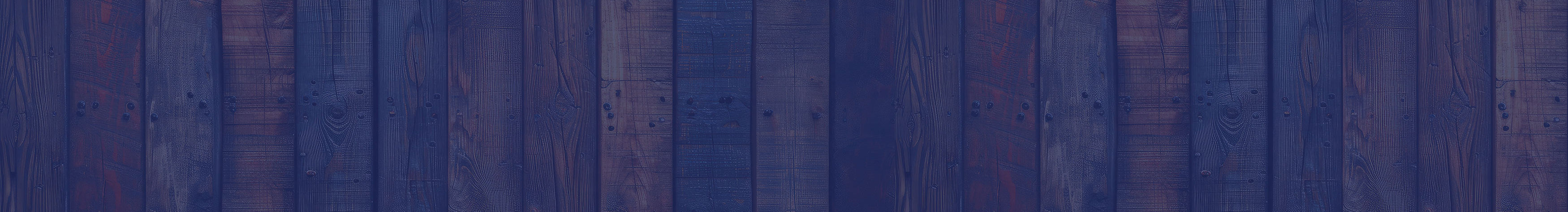 Barnwood siding representing a barn, a likely home for animals that could benefit from ForeFront supplements that enhance performance, recovery, and vitality for both equine athletes and canine companions.